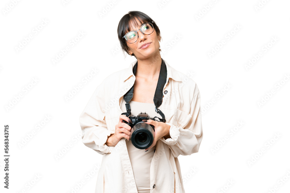 Young photographer caucasian woman over isolated chroma key background looking up while smiling Young photographer caucasian woman over isolated chroma key background looking up while smiling