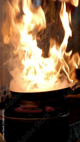 Wallpaper Mural Lockdown cropped hands of man flambeing food in cooking pan on stove at kitchen Torontodigital.ca