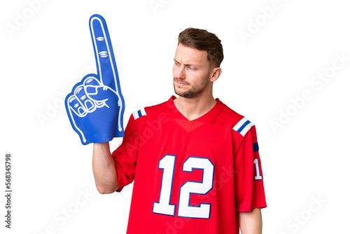 Young caucasian sports fan man over isolated chroma key background with sad expression