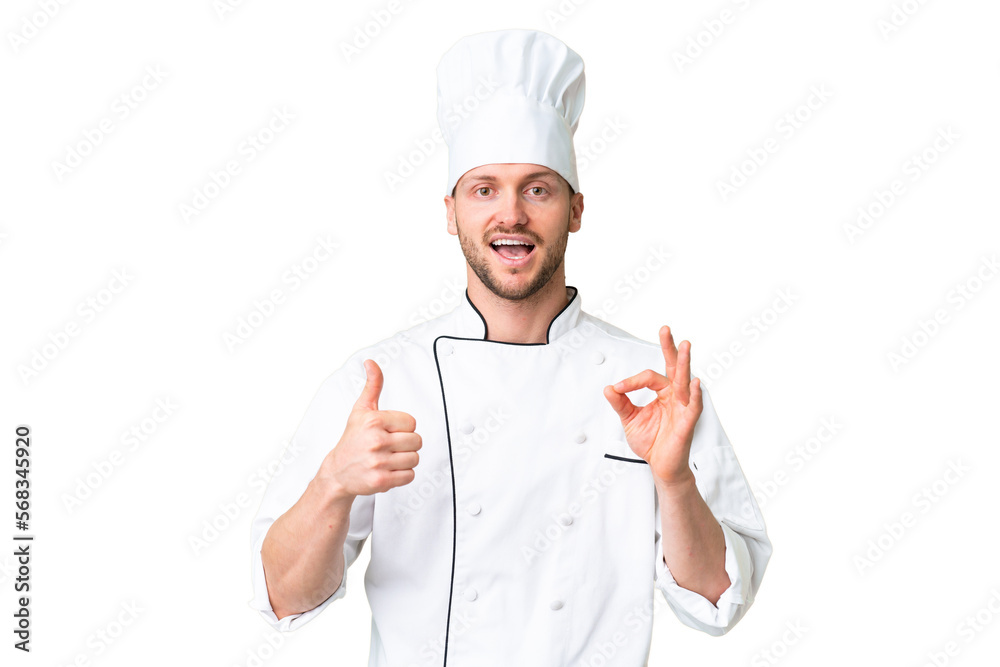 Young caucasian chef over isolated chroma key background showing ok sign and thumb up gesture Young caucasian chef over isolated chroma key background showing ok sign and thumb up gesture