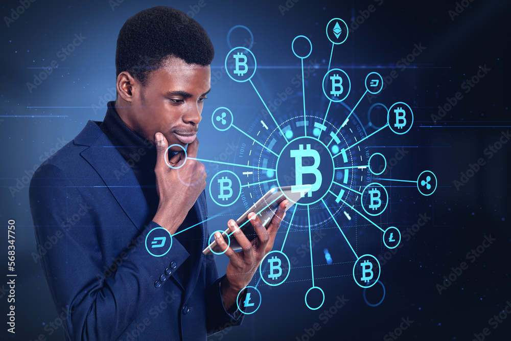 African businessman with tablet, bitcoin hologram icons and bloc African businessman with tablet, bitcoin hologram icons and bloc