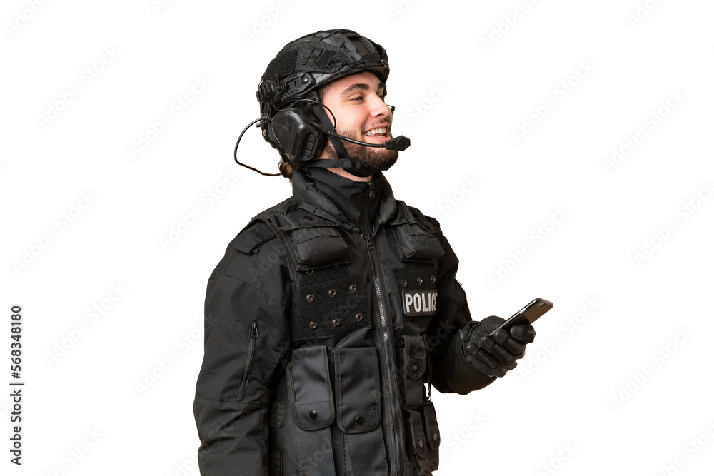 SWAT over isolated chroma key background keeping a conversation with the mobile phone with someone SWAT over isolated chroma key background keeping a conversation with the mobile phone with someone