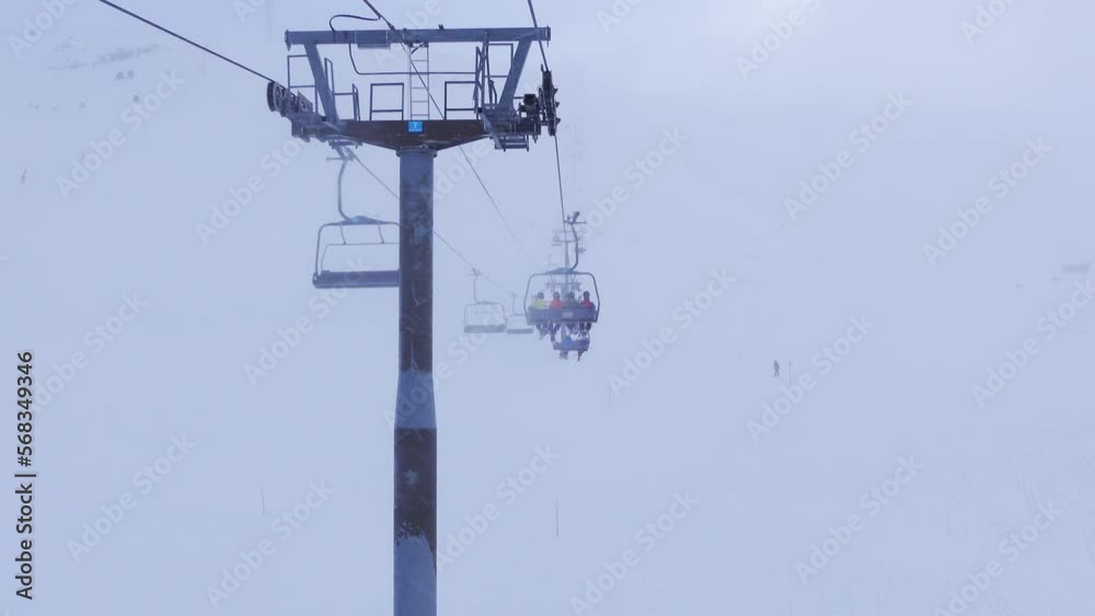 Chairlift that transports skiers to the ski slopes on a day with a lot of fog and low visibility, Andorra. Chairlift that transports skiers to the ski slopes on a day with a lot of fog and low visibility, Andorra.