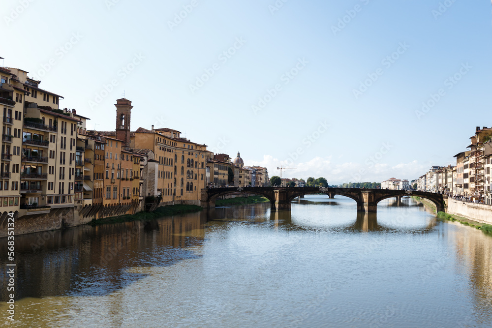 streets with colored old houses and bridges in the middle of Florence