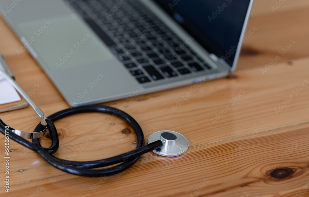 Doctor stethoscope on laptop at desk, healthcare and medical concept. Doctor stethoscope on laptop at desk, healthcare and medical concept.