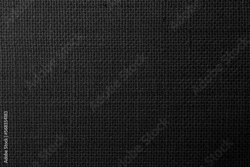 Black hemp rope texture background. Haircloth wale black dark cloth wallpaper. Rustic sackcloth canvas fabric texture in natural. 