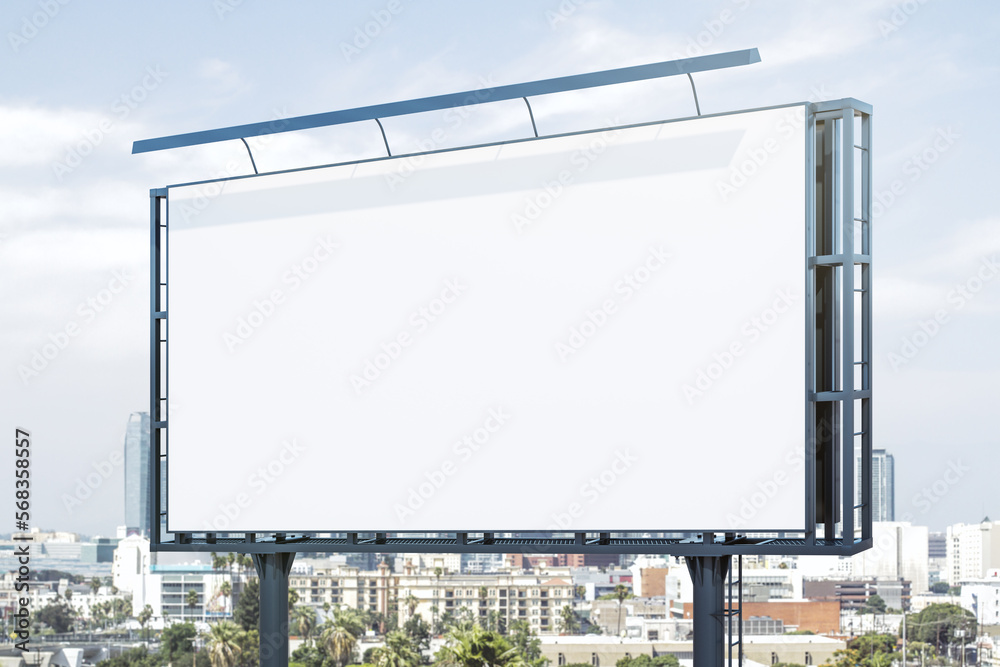 Blank white horizontal billboard on city buildings background at daytime, perspective view. Mockup, advertising concept Blank white horizontal billboard on city buildings background at daytime, perspective view. Mockup, advertising concept