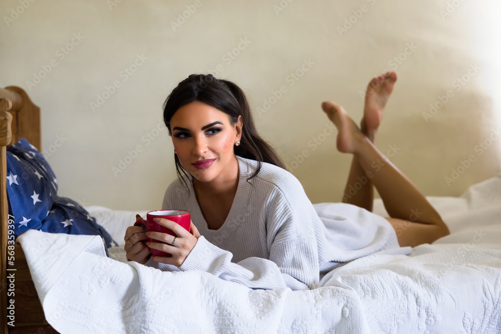 Posing woman with mug of coffee