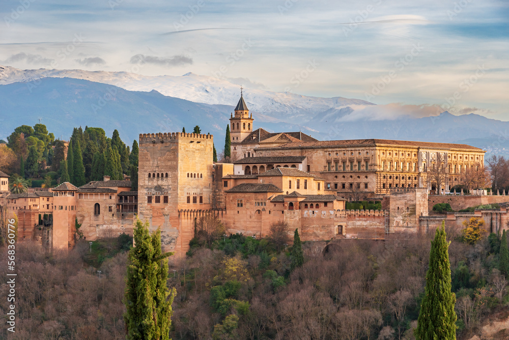 Palace of Carlos V in the Arab complex of the Alhambra in Granada, with Sierra Nevada in the background, with daylight.
