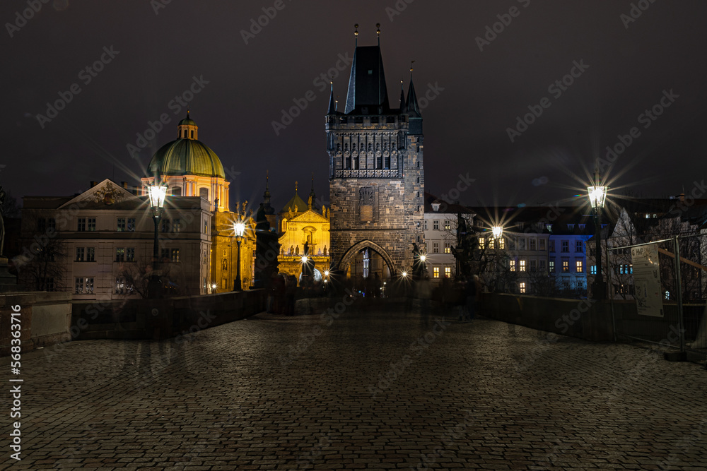 charles bridge. Views of Prague city at night, Charles Bridge in Prague with unrecognisable people on the move. Prague by night