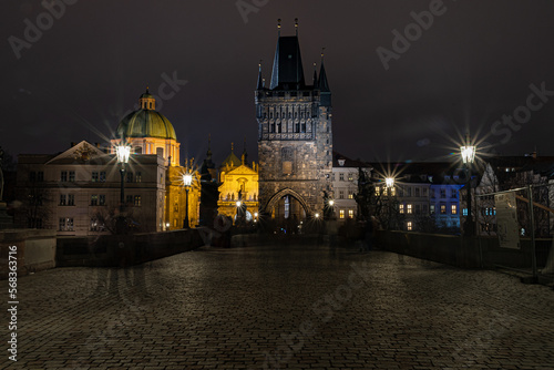 charles bridge. Views of Prague city at night  Charles Bridge in Prague with unrecognisable people on the move. Prague by night
