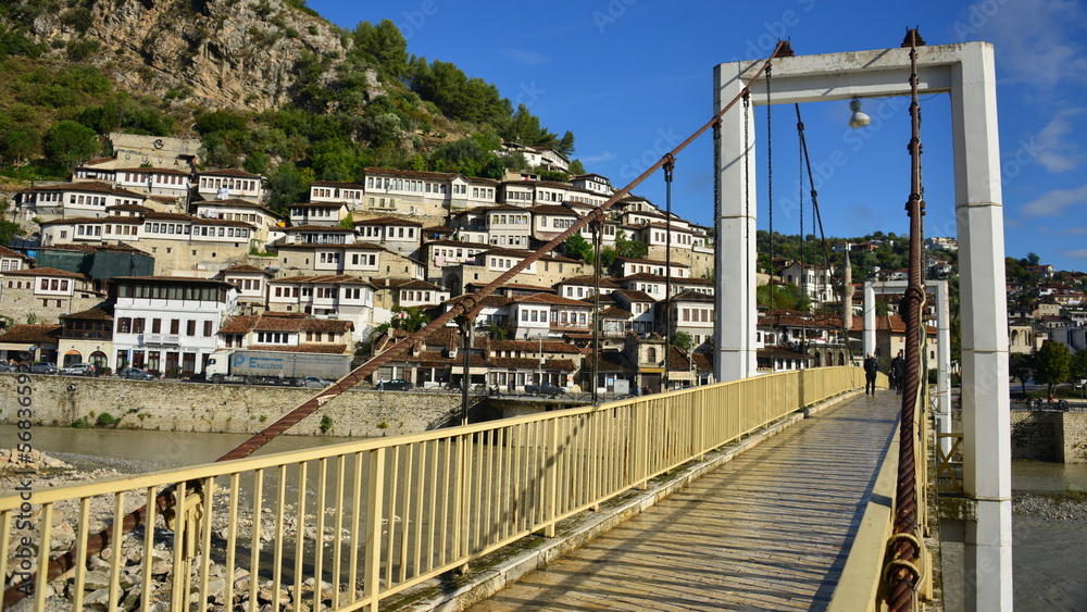 Berat is a city on the Osum River in central Albania. It is famous for the white Ottoman houses and for the castle of Berat, a huge complex on the hill where some citizens now reside. inside its walls