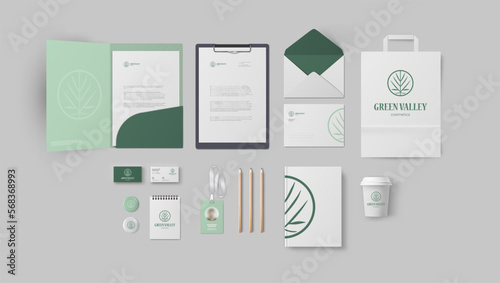 Branding design for cosmetic company with green logo and mild colors, premium corporate identity style with elements pack include folder and business card