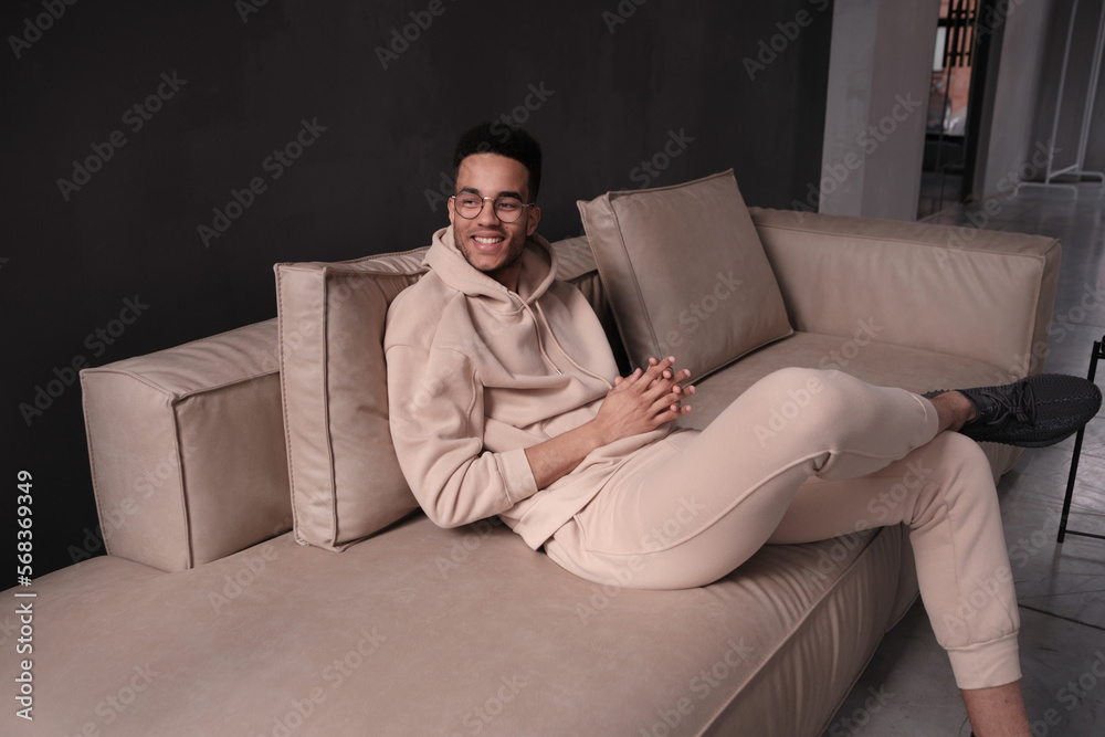 Handsome african american man wearing casual clothes and glasses happy face smiling looking at the camera. positive person. Handsome african american man wearing casual clothes and glasses happy face smiling looking at the camera. positive person.