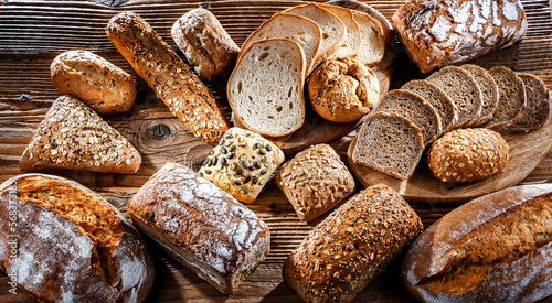 Assorted bakery products including loafs of bread and rolls