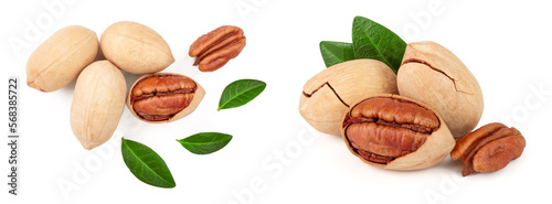 pecan nut decorated with green leaves isolated on white background. Top view. Flat lay