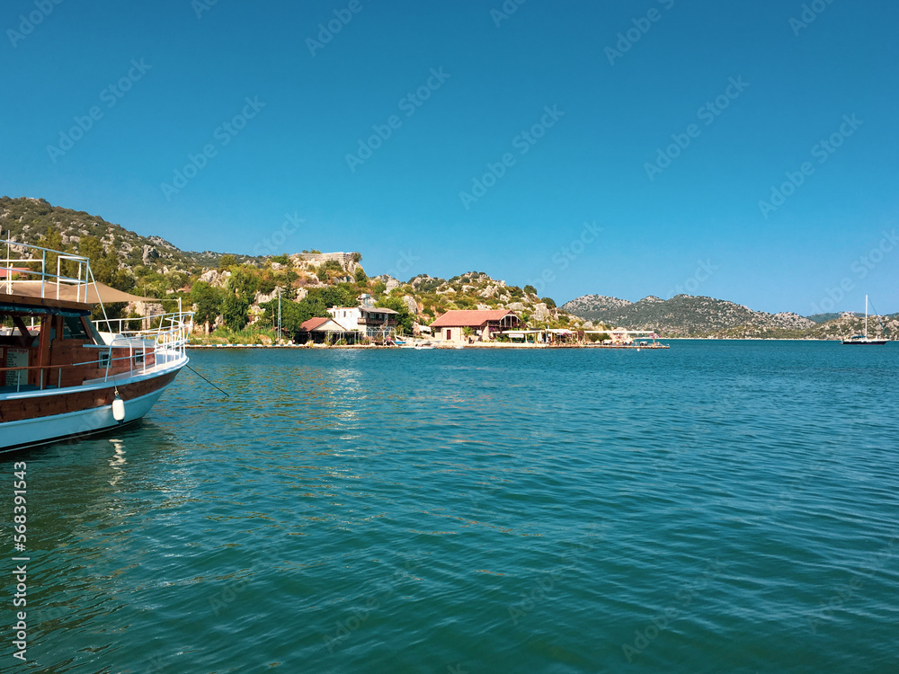 View of Kayakoy Kekova Simena village. Sunken city of Kekova in bay of Ucagiz view from sea in Antalya province of Turkey	