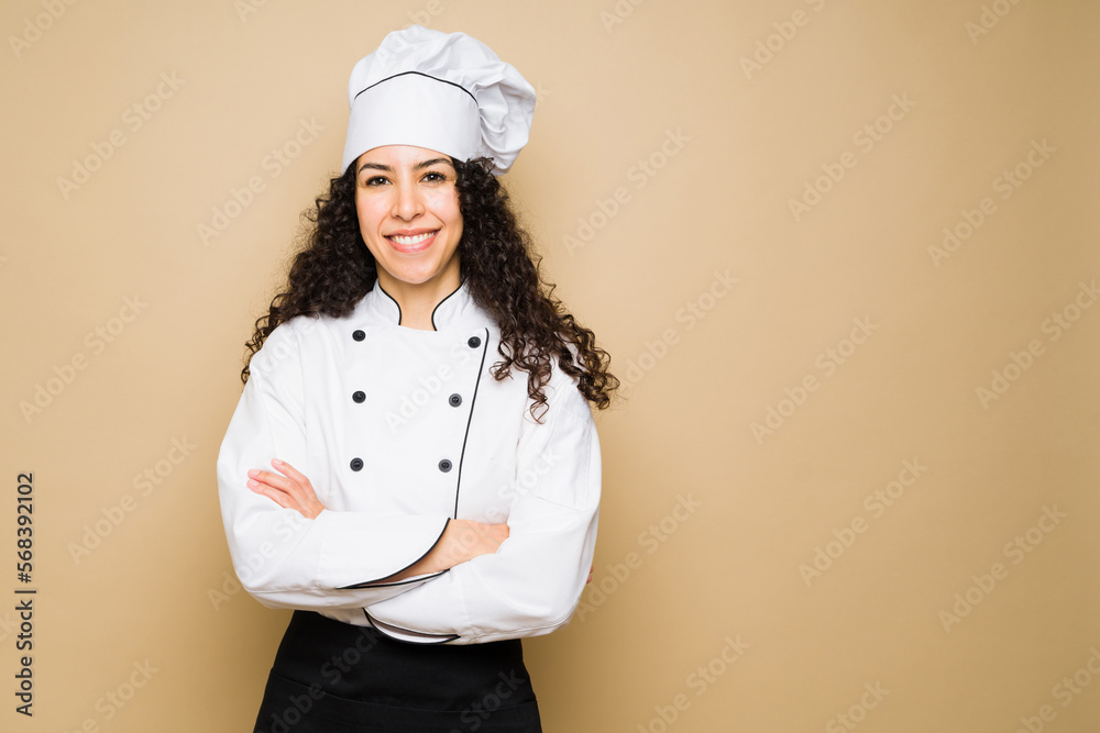 Attractive happy woman chef smiling Attractive happy woman chef smiling