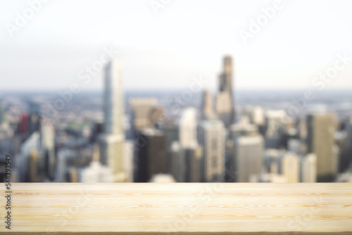 Empty tabletop made of wooden dies with blurry city view in sunny weather on background  template