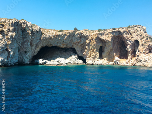 The cave called Karakoyuk after Palamutbuku on the Mediterranean side in Muğla Datca, Turkey. View from the cliffs down to a picturesque sea bay with cave. photo