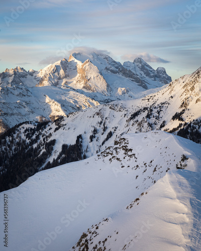 winter sunrise over snow covered mountain - Marmolada in Dolomites  photo