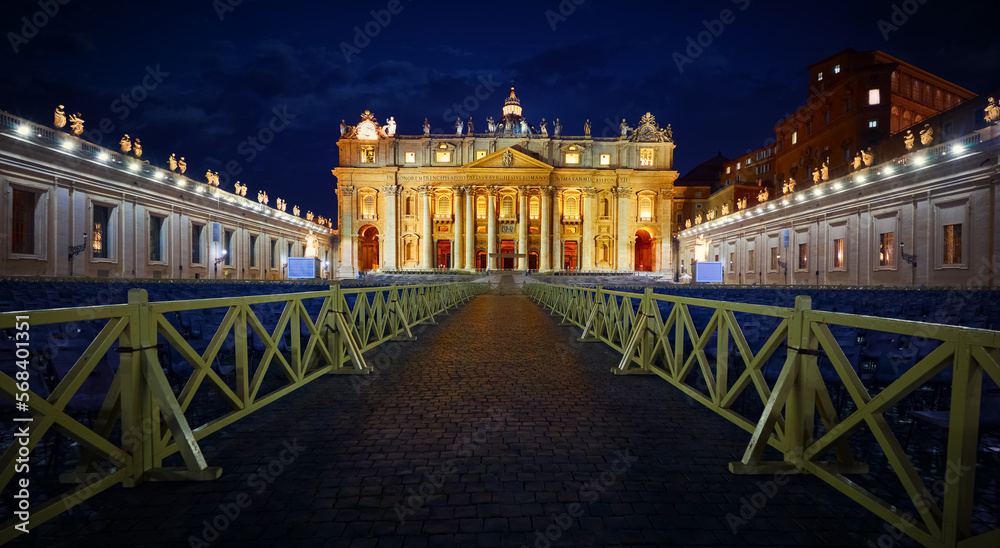 Obraz premium Vatican City (Holy See. Way to St. Peter's Basil cathedral on Saint Square. Nighttime, blue hour with night sky and street lamps illumination. Rome, Italy. Famous travel destination touristic landmark