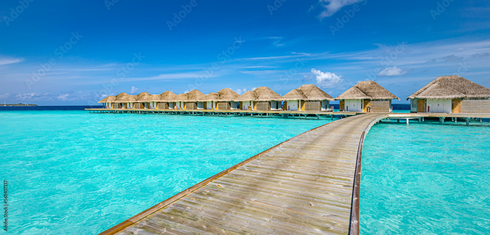 Fototapeta premium Maldives paradise island. Tropical aerial landscape, seascape with jetty, water bungalows villas with amazing sea lagoon beach. Exotic tourism destination, summer vacation background. Aerial travel 