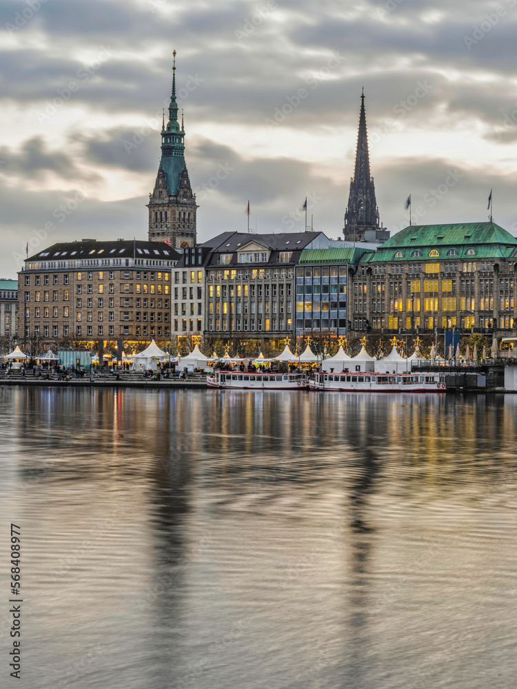 Hamburg city centre on lake Binnenalster wat sunset with christmas lights, Germany Hamburg city centre on lake Binnenalster wat sunset with christmas lights, Germany