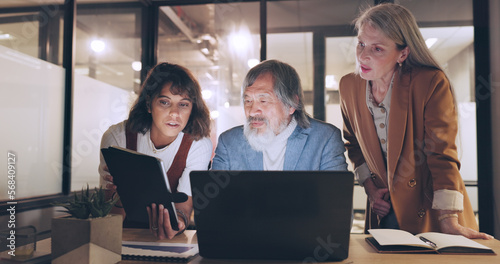 Laptop, tablet and business people teamwork on night project, digital finance portfolio or feedback review of stock market research. Financial economy, investment collaboration and trader trading nft