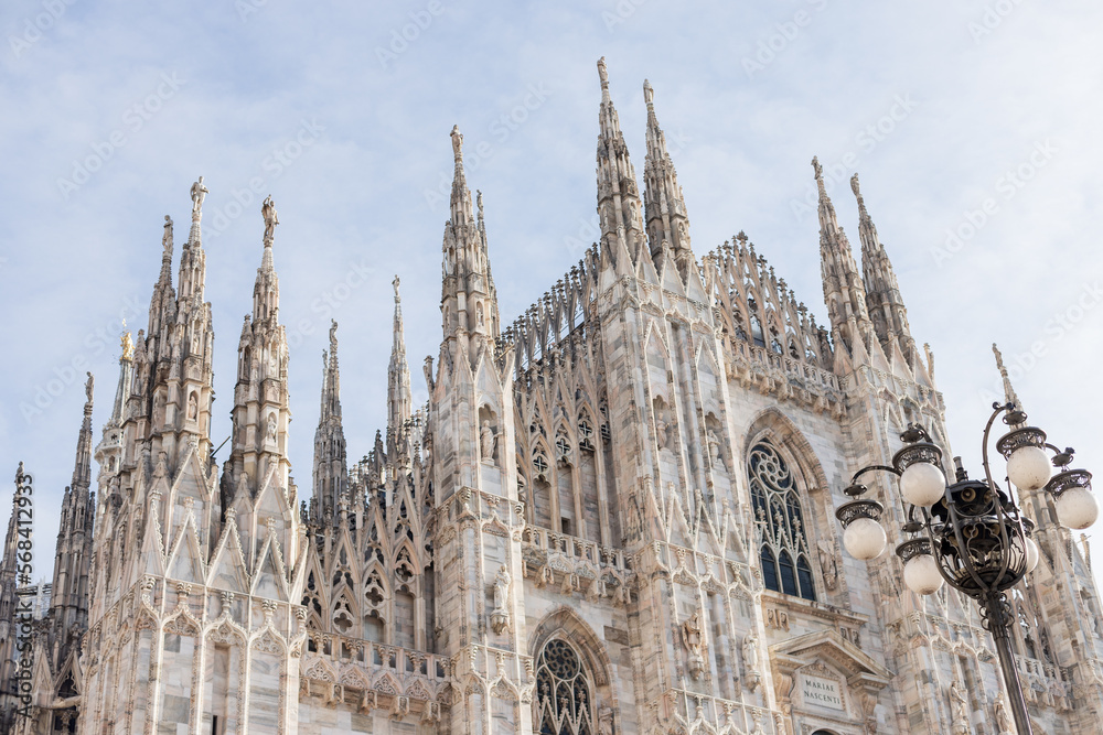 Building church historical facade looking up Duomo cathedral Milano city 