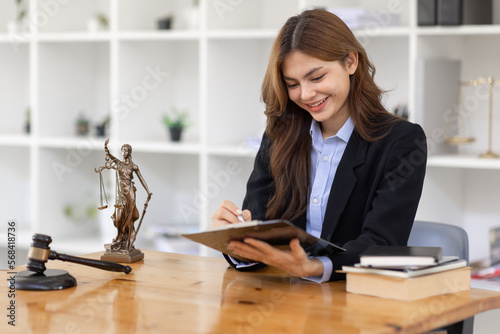 female business woman lawyers working at the law firms. Judge gavel with scales of justice. Legal law, lawyer, documents, advice and justice concept.