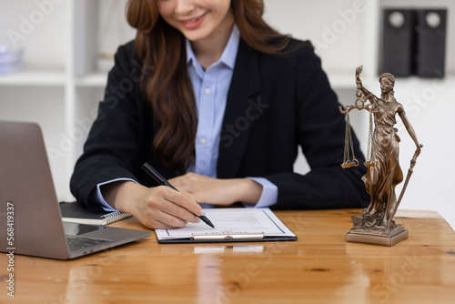 female business woman lawyers working at the law firms. Judge gavel with scales of justice. Legal law, lawyer, documents, advice and justice concept.
