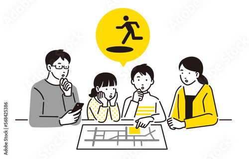ハザードマップ で避難経路を確認する親子