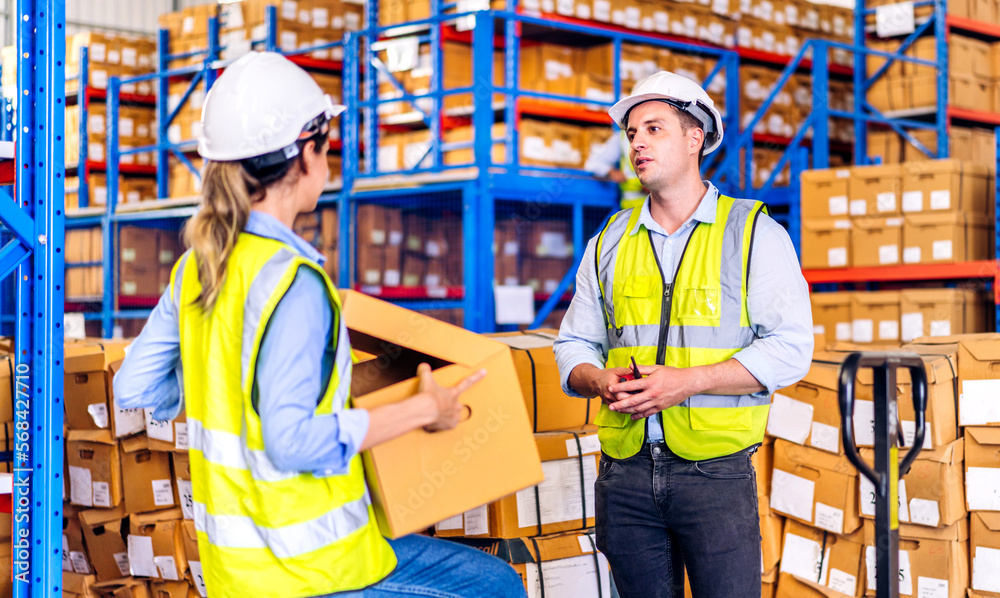 Two engineer team shipping order detail check goods and supplies on shelves with goods background inventory in factory warehouse.logistic industry and business export Two engineer team shipping order detail check goods and supplies on shelves with goods background inventory in factory warehouse.logistic industry and business export