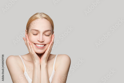 Portrait of beautiful woman isolated on grey background. Beauty  cosmetics  skincare  glamour