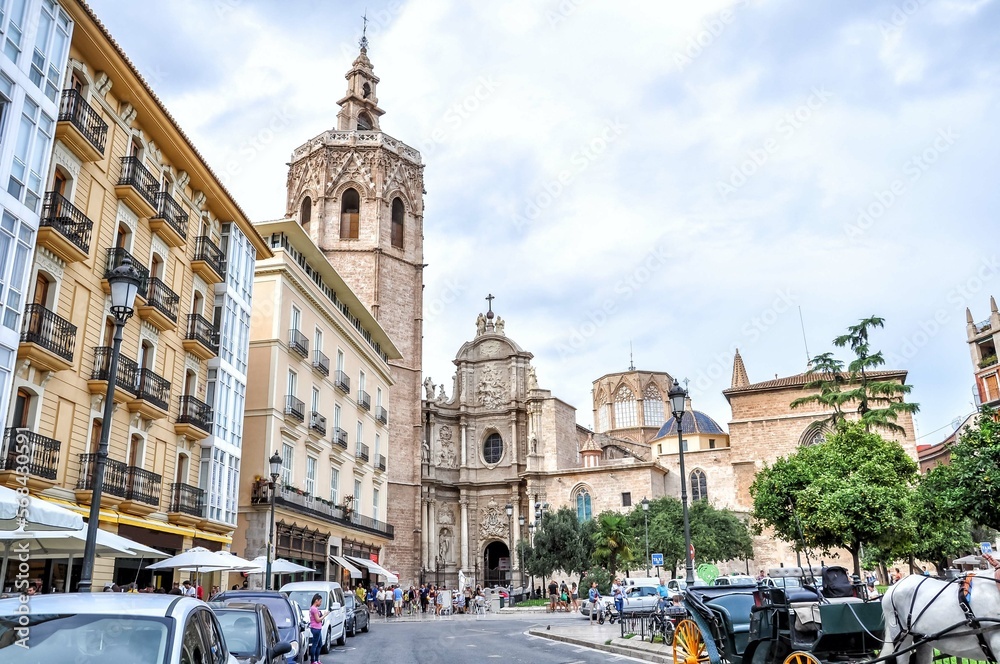 Fototapeta premium Valencia is one big open-air museum with historic buildings such as the cathedral with the Gothic bell tower El Miguelete. Valencia, Spain, Europe.