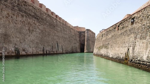 View from a tourist boat of the Royal Walls of Ceuta and its navigable moat photo