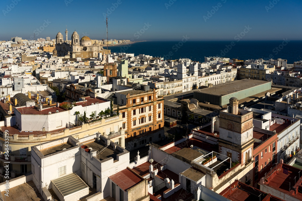 Fototapeta premium Panoramic view of the city of Cadiz at sunset since Tavira tower lookout with the cathedral, Andalucia, Spain.