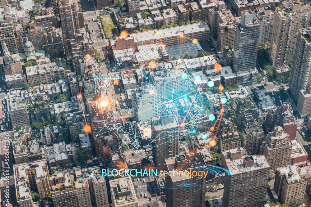 Fototapeta premium Aerial top view of New York City building roofs. Bird's eye view from helicopter of metropolis cityscape. Decentralized economy. Blockchain, cryptography and cryptocurrency concept, hologram