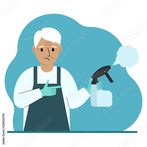 A man in gloves holds a spray bottle with disinfectant liquid, antiseptic or detergent. Home disinfection and hygiene.