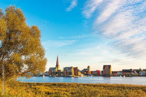 Blick über die Warnow auf die Hansestadt Rostock am Abend photo