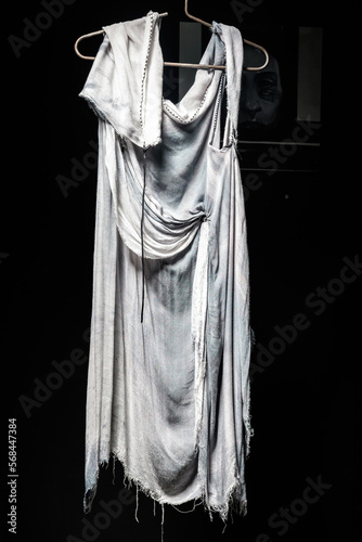 Fashionable women's draped white dress