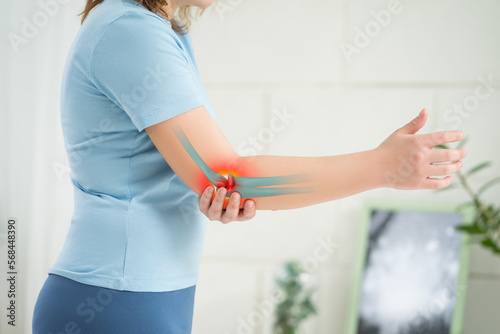 Diseases of the elbow joint, bone fracture and inflammation, woman suffering from pain in cubit photo