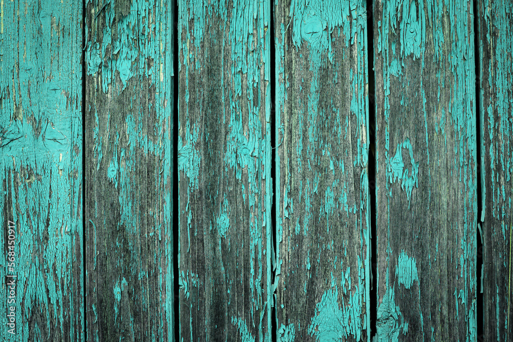 Old natural weathered wooden planks with cracked blue paint background Old natural weathered wooden planks with cracked blue paint background