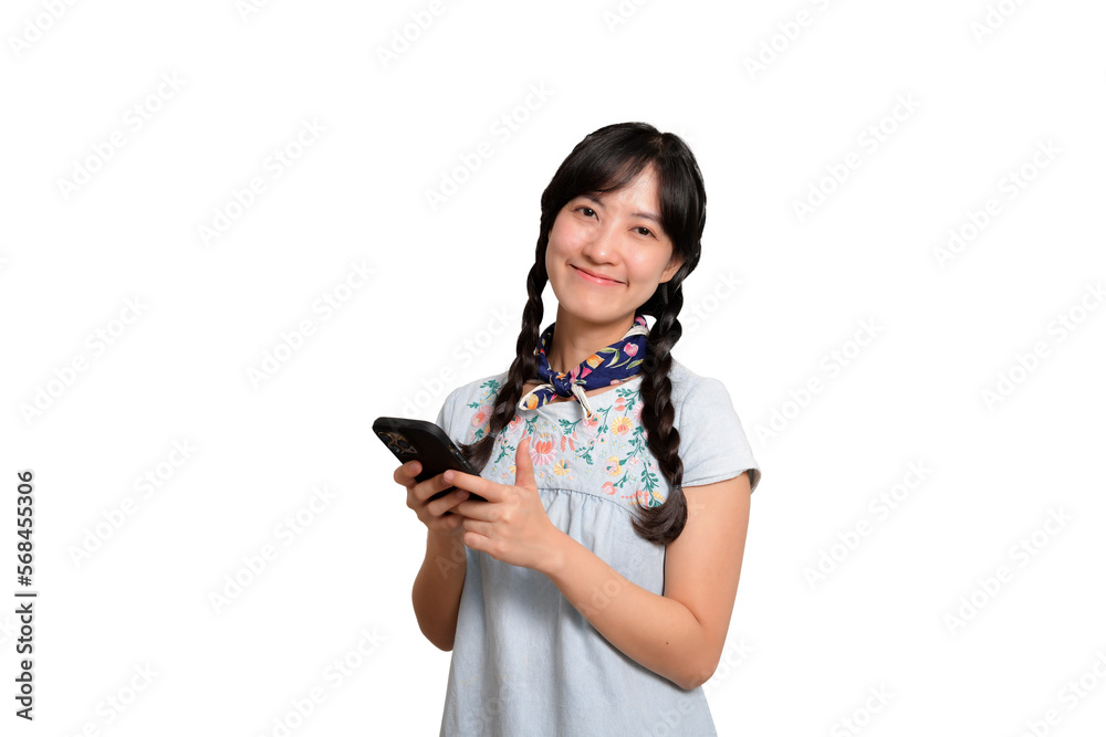 Portrait of happy beautiful young asian woman in denim dress using a smartphone on white background. studio shot Portrait of happy beautiful young asian woman in denim dress using a smartphone on white background. studio shot