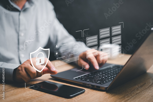 Cybersecurity global network security and technology concept, Businessman use smartphone and laptop security encryption to manage important documents safely online and secure storage