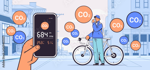 man cycling outdoor with with air quality monitor test on the presence of dangerous CO2 control level testing