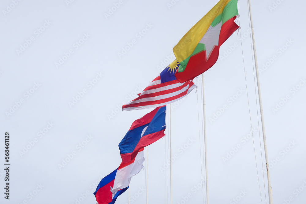 The flags of Association of Southeast Asian Nations or ASEAN over the clear blue sky. 