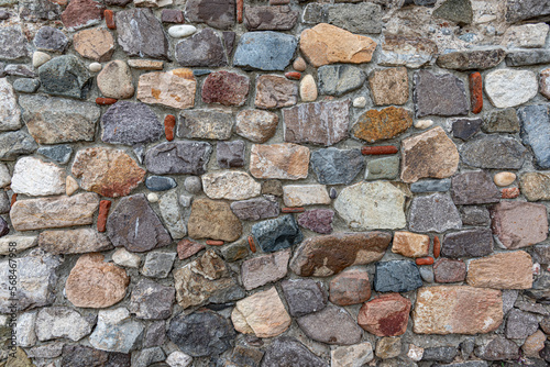 Stone masonry wall as an abstract background.