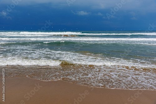 Storm sea. Waves on the sea dispersed by the wind on a cloudy day.